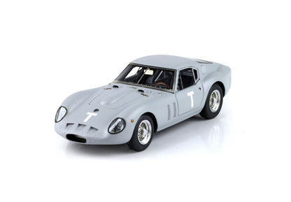 Gray vintage race car model with T decals on hood and door, available through Vroomi