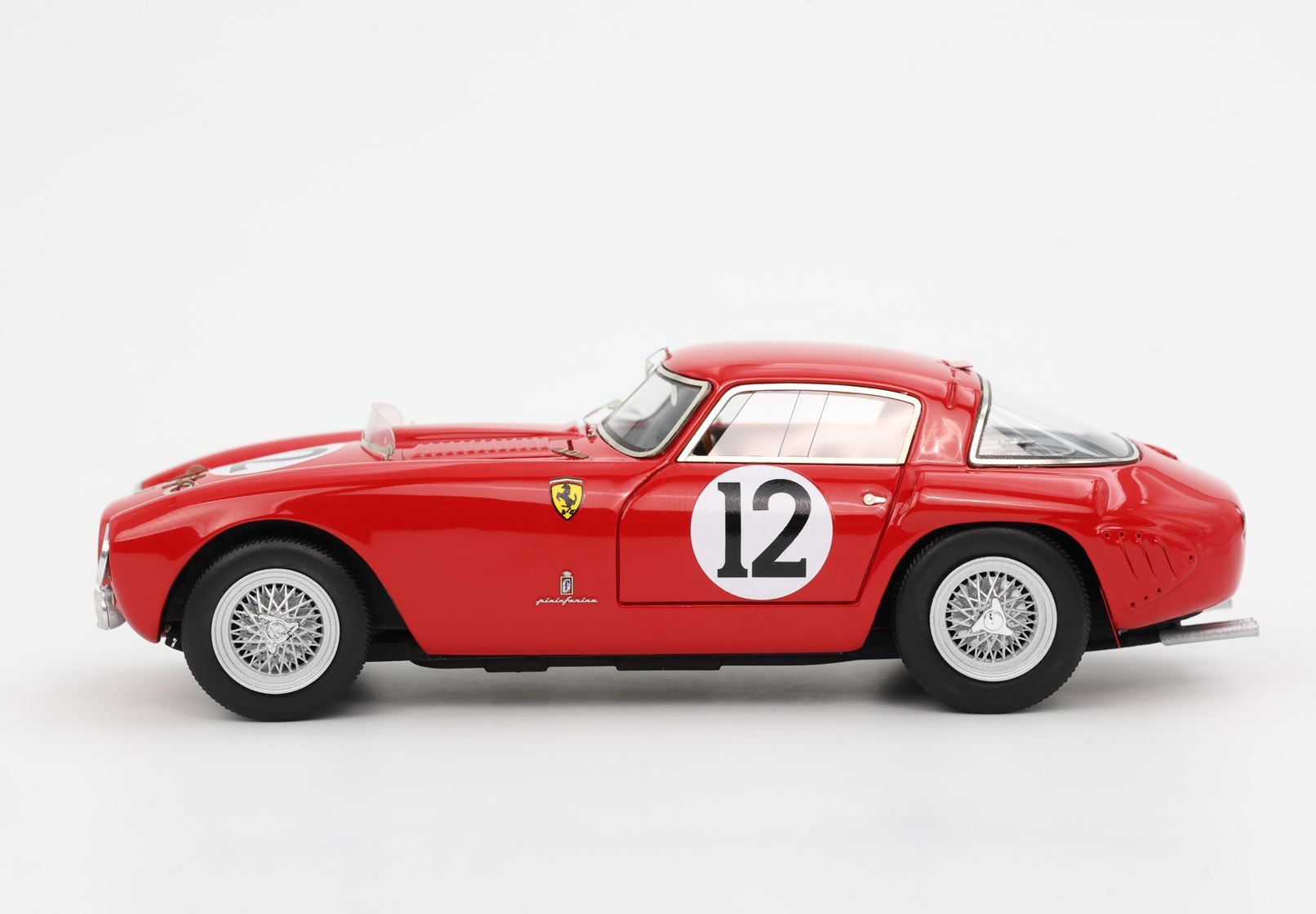 Red vintage Ferrari race car model with number 12, Pininfarina logo, available on Vroomi