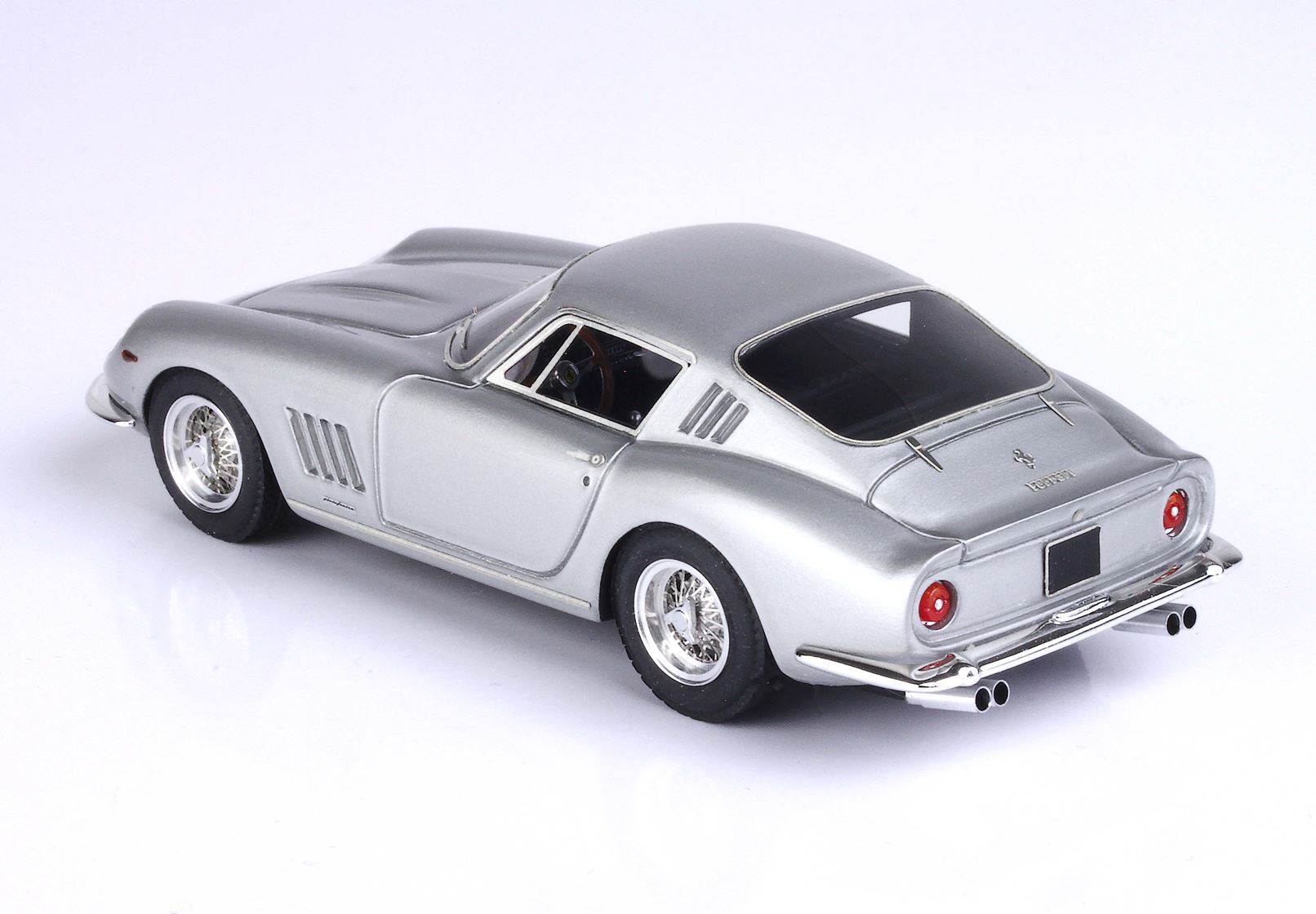 Silver classic Ferrari model car with detailed wheels and rear exhaust, available on Vroomi