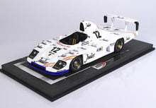 White Porsche 935 race car model with Jules branding and number 12 on display base, available on Vroomi