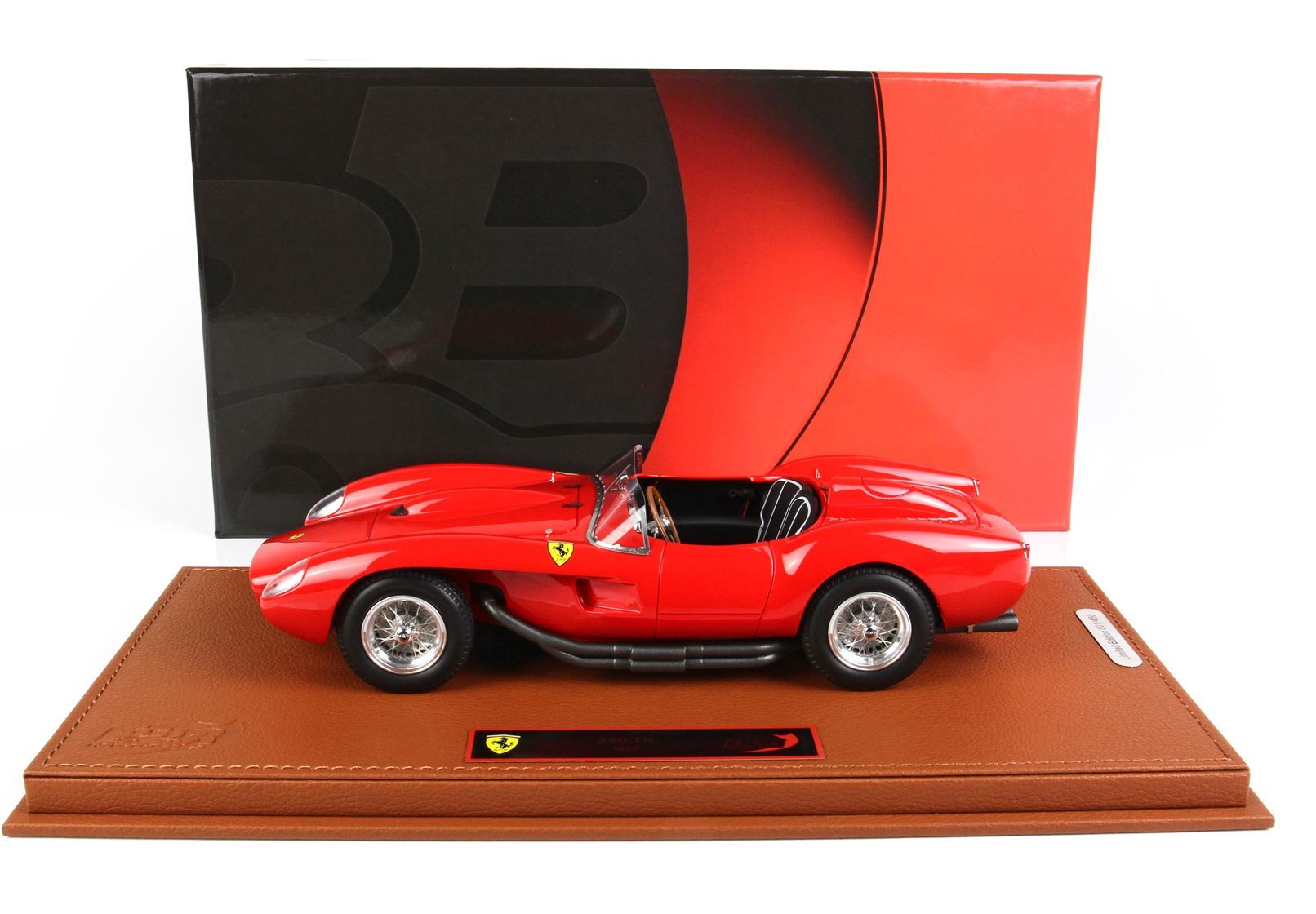 Red Ferrari 250 TR model car on brown display base with black and red background, available via Vroomi