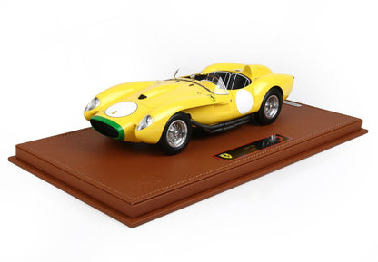 Yellow Ferrari 250 TR model car on brown display base, listed on Vroomi