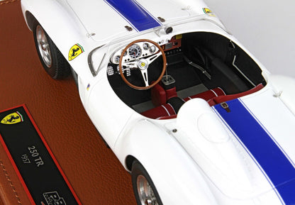 White 1957 Ferrari 250 TR model car with blue racing stripe and red seats available on Vroomi