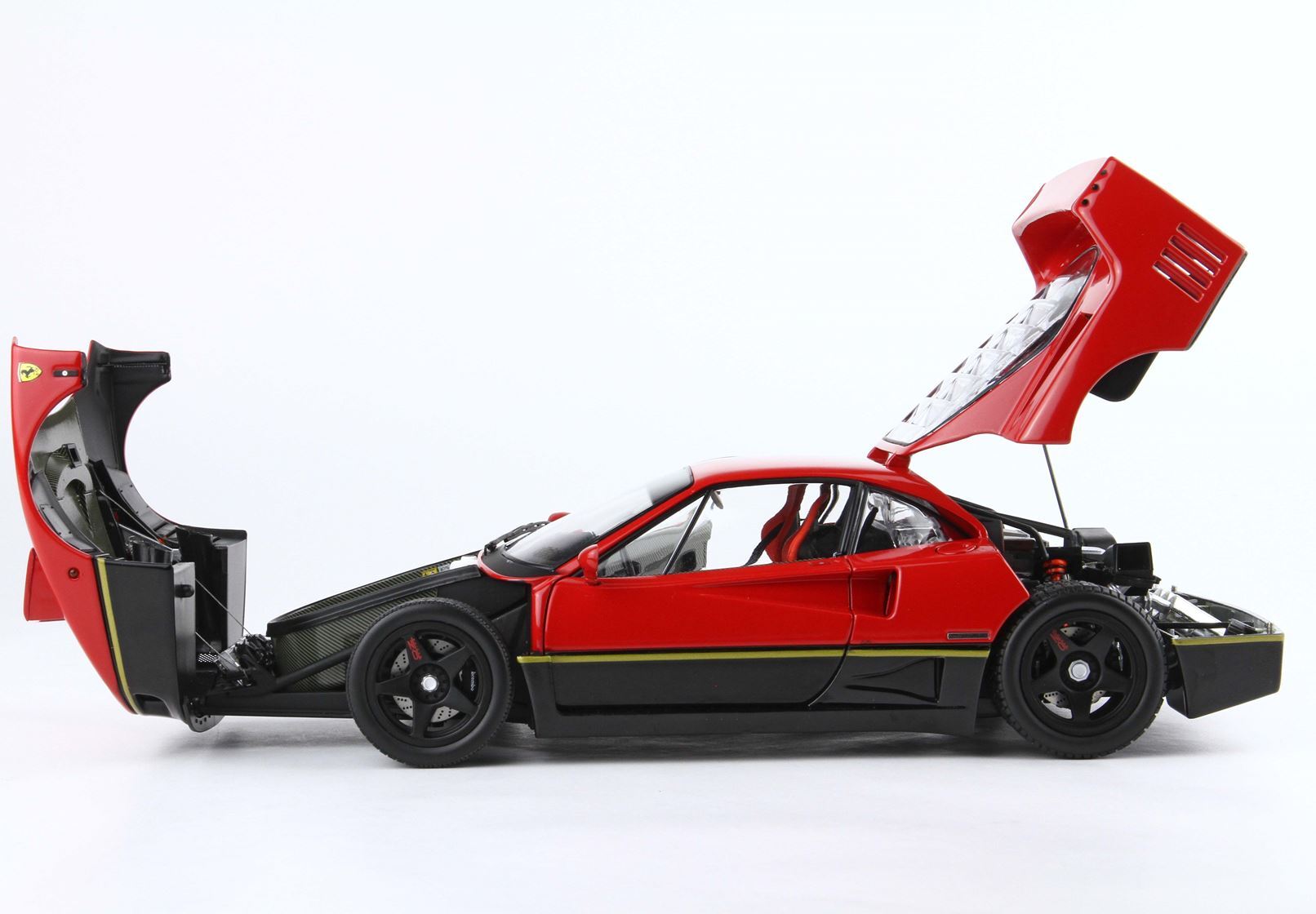 Red and black Ferrari sports car model with open front and rear hoods, available on Vroomi platform