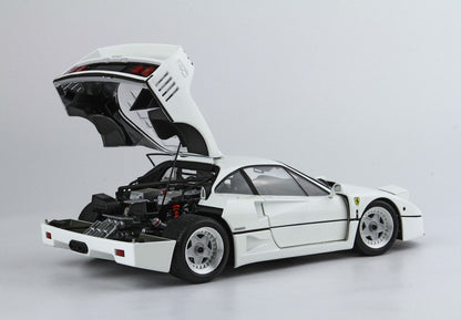 White Ferrari F40 sports car with open rear hood showing engine, available through Vroomi