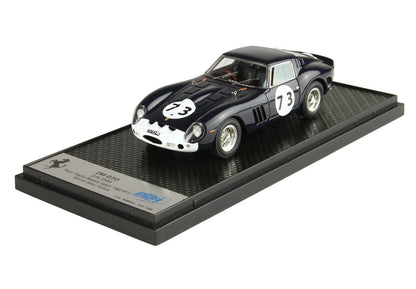 Detailed model of a black and white Ferrari 250 GTO race car with number 73, displayed on a textured stand, offered on Vroomi