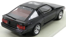 Modello di auto sportiva Mitsubishi Starion nera con tetto apribile e tergicristallo posteriore, in vendita su Vroomi.