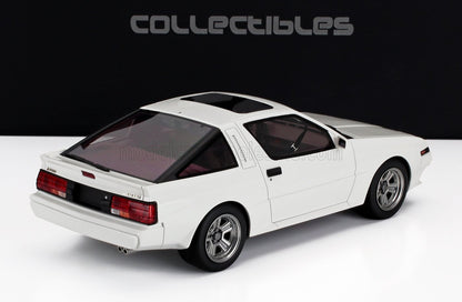Modellino vintage bianco Mitsubishi Starion con tetto apribile, spoiler posteriore e cerchi argentati, in vendita su Vroomi.