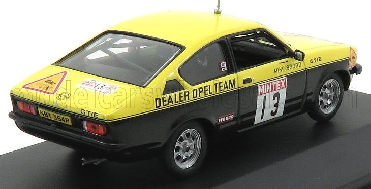 Auto da rally Opel GT/E vintage gialla e nera con il numero 13, adesivi "Dealer Opel Team", disponibile su Vroomi.