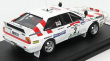 Modellino in scala 1/18 dell'Audi Quattro da rally con adesivi da gara, ora disponibile online per i collezionisti.