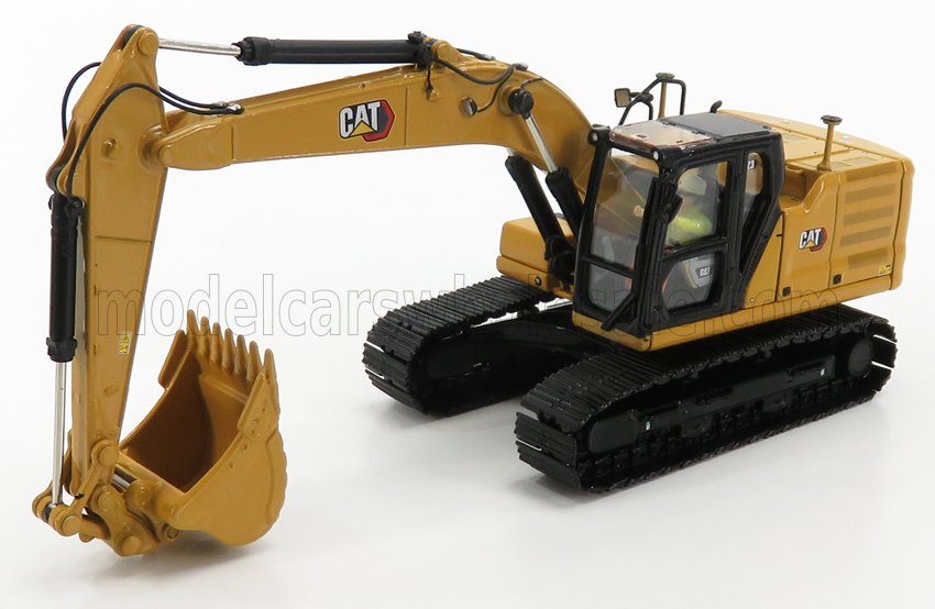 Modellino diecast di un escavatore CAT giallo e nero, con cingoli e benna, venduto da Vroomi.