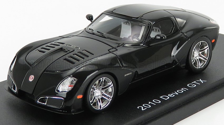 Modello di auto sportiva Devon GTX nera del 2010 con cerchi cromati, esposta su una piattaforma, in vendita tramite Vroomi.