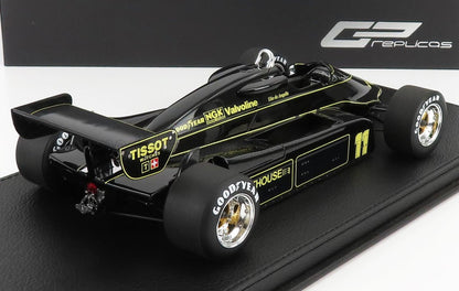 Modellino vintage di auto di Formula 1 nero con dettagli gialli e loghi degli sponsor in bella vista, disponibile su Vroomi.