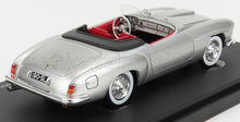 Silver classic model convertible car with red interior, detailed dashboard, on black display base, available on Vroomi