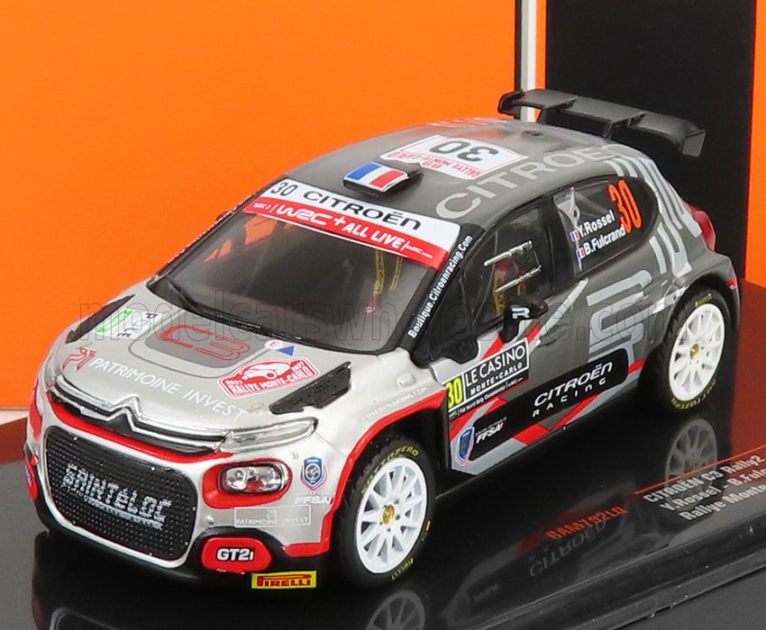 Modellino in miniatura della Citroën C3 Rally2 con adesivi da gara in esposizione, disponibile sulla piattaforma Vroomi.