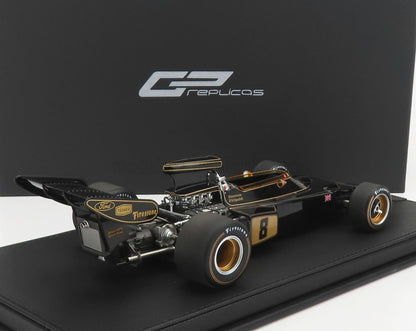 Modellino di auto da corsa Lotus 72 Formula 1 nero e oro con pneumatici Firestone, disponibile su Vroomi.