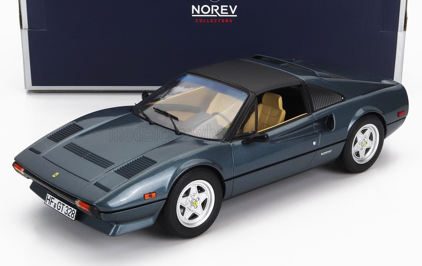 Modellino Ferrari 328 GTS grigio scuro con interni color cuoio, esposto nella confezione da collezione Norev, disponibile su Vroomi.