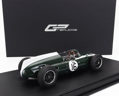 Modellino di auto da corsa vintage verde e bianco numero 16 su base nera, disponibile su Vroomi