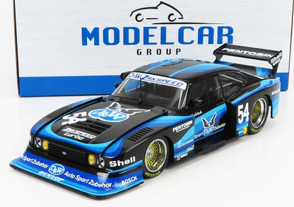 Modellino di auto da corsa Ford in scala 1/18, nero e blu, con il numero 54 e i loghi degli sponsor, disponibile su Vroomi.