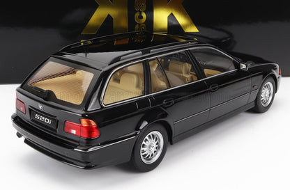 BMW 520i classica station wagon nera con interni beige, disponibile su Vroomi.