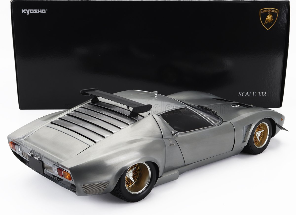 Modellino di Lamborghini Miura Kyosho in scala 1:12 con finitura in metallo spazzolato e cerchi dorati, disponibile su Vroomi.