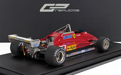 Modello vintage rosso di auto da corsa Ferrari Formula 1 con pneumatici Goodyear e loghi degli sponsor, in vendita su Vroomi.