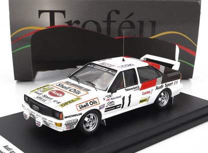 Modellino di auto da rally bianca Audi Sport UK con adesivi Shell Oils, esposto con la confezione Troféu, disponibile su Vroomi.