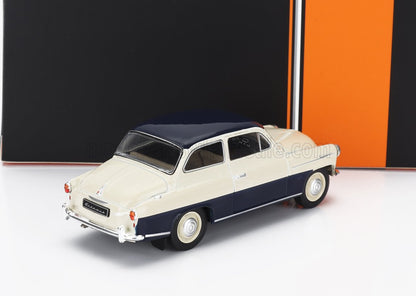 Modellino d'auto vintage bicolore color crema e blu navy esposto su sfondo nero e arancione, disponibile su Vroomi.