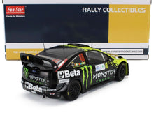 Modellino di auto da rally nera in scala 1/18 con livrea Monster Energy, disponibile su Vroomi.