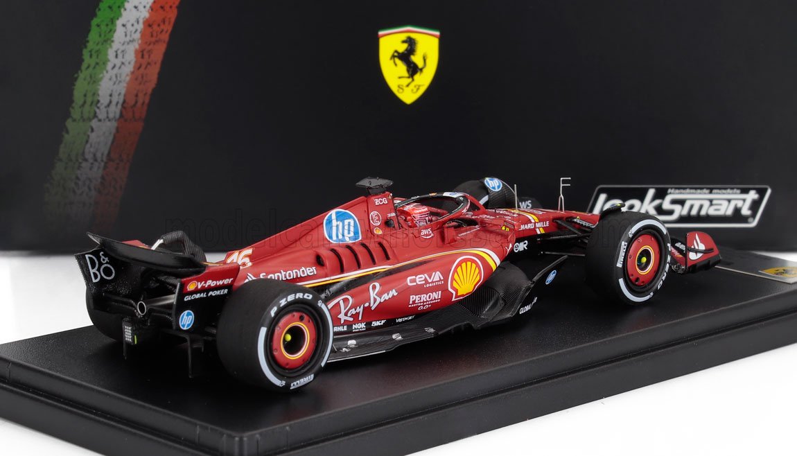 Modellino di auto da corsa Ferrari Formula 1 rossa con adesivi degli sponsor esposto su un supporto nero, ora disponibile su Vroomi.