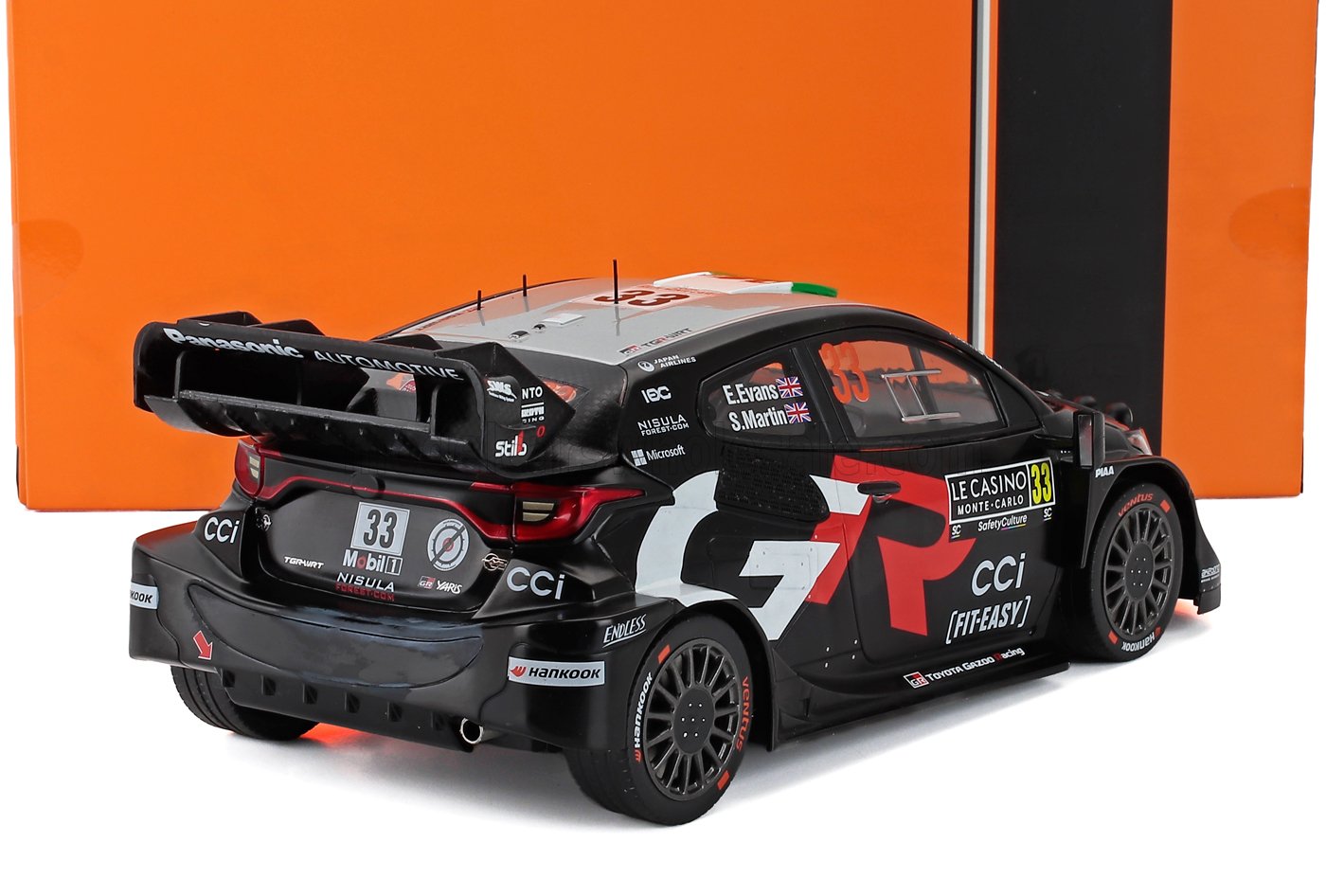 Black Toyota Yaris WRC rally car model with racing decals and spoiler, available on Vroomi