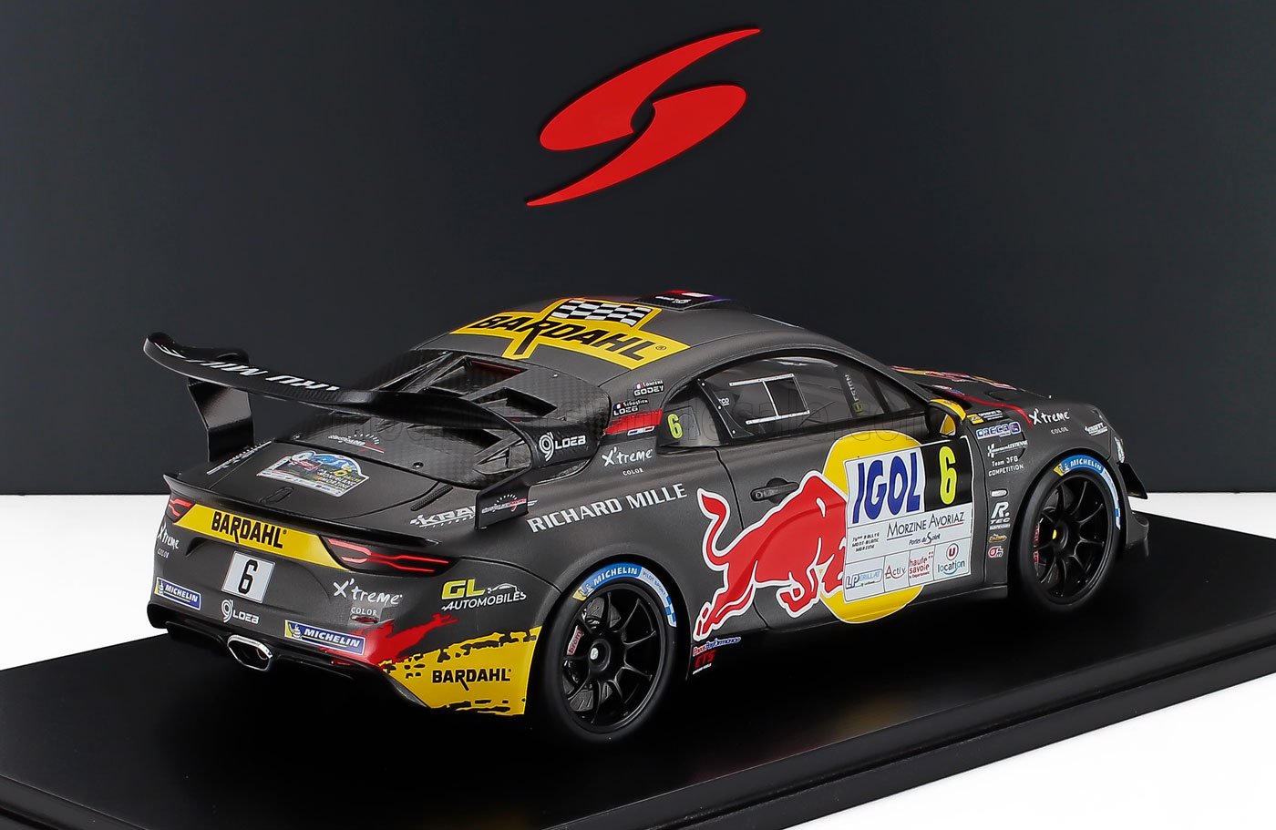 Black racing model car with Red Bull and Bardahl logos, number 6, featured on Vroomi platform