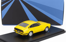 Yellow Anadol model car on black display stand with blue and black geometric background, now on Vroomi