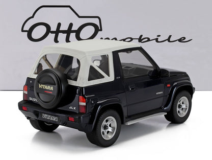 Modellino in bianco e nero della Suzuki Vitara JLX con ruota di scorta, con il logo Otto mobile, disponibile su Vroomi.