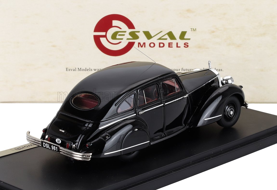 Modellino d'auto vintage Esval nero su espositore, design classico berlina, ora disponibile su Vroomi.
