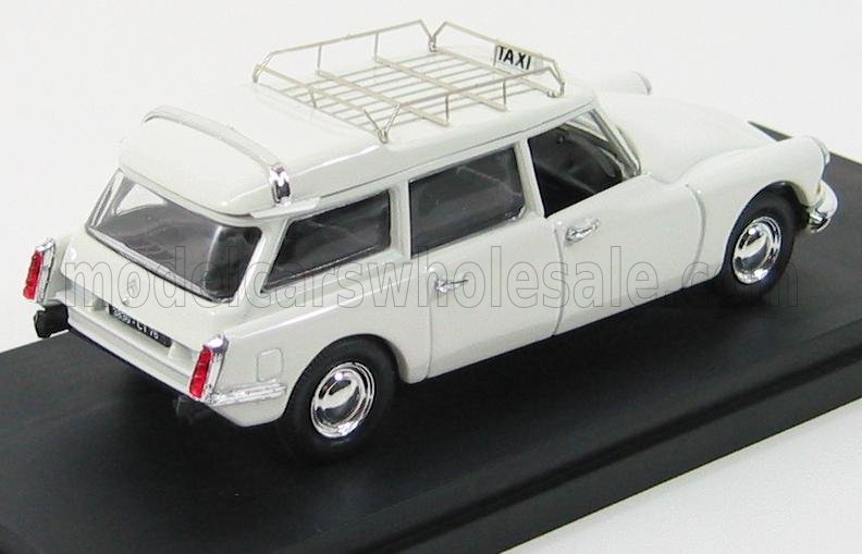 Modello vintage bianco Citroën DS station wagon con insegna taxi e portapacchi sul tetto, presente sulla piattaforma Vroomi.