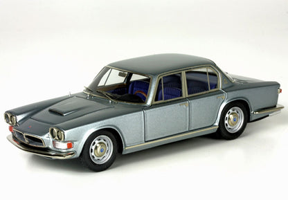 Vintage silver classic four-door model car with blue interior, available on Vroomi platform