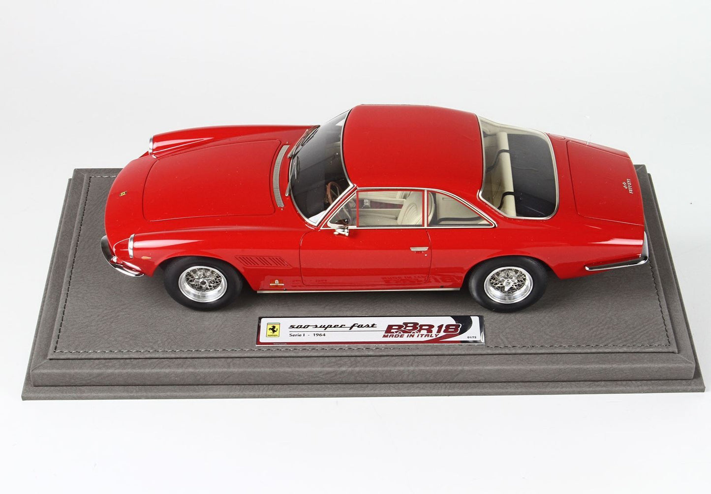 Red Ferrari 500 Superfast model car on leather base, series 1 1964, available via Vroomi