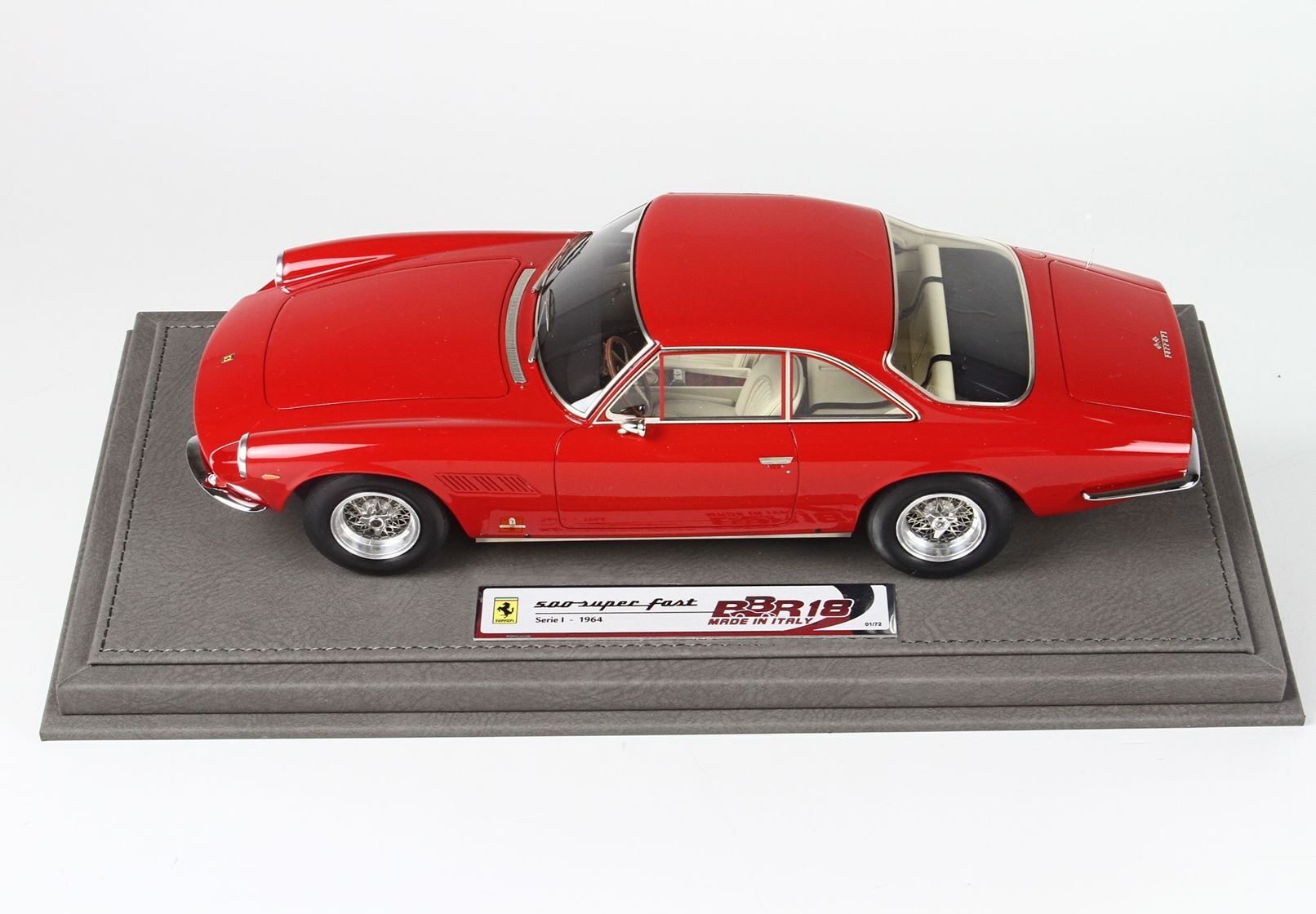 Red Ferrari 500 Superfast model car on leather base, series 1 1964, available via Vroomi