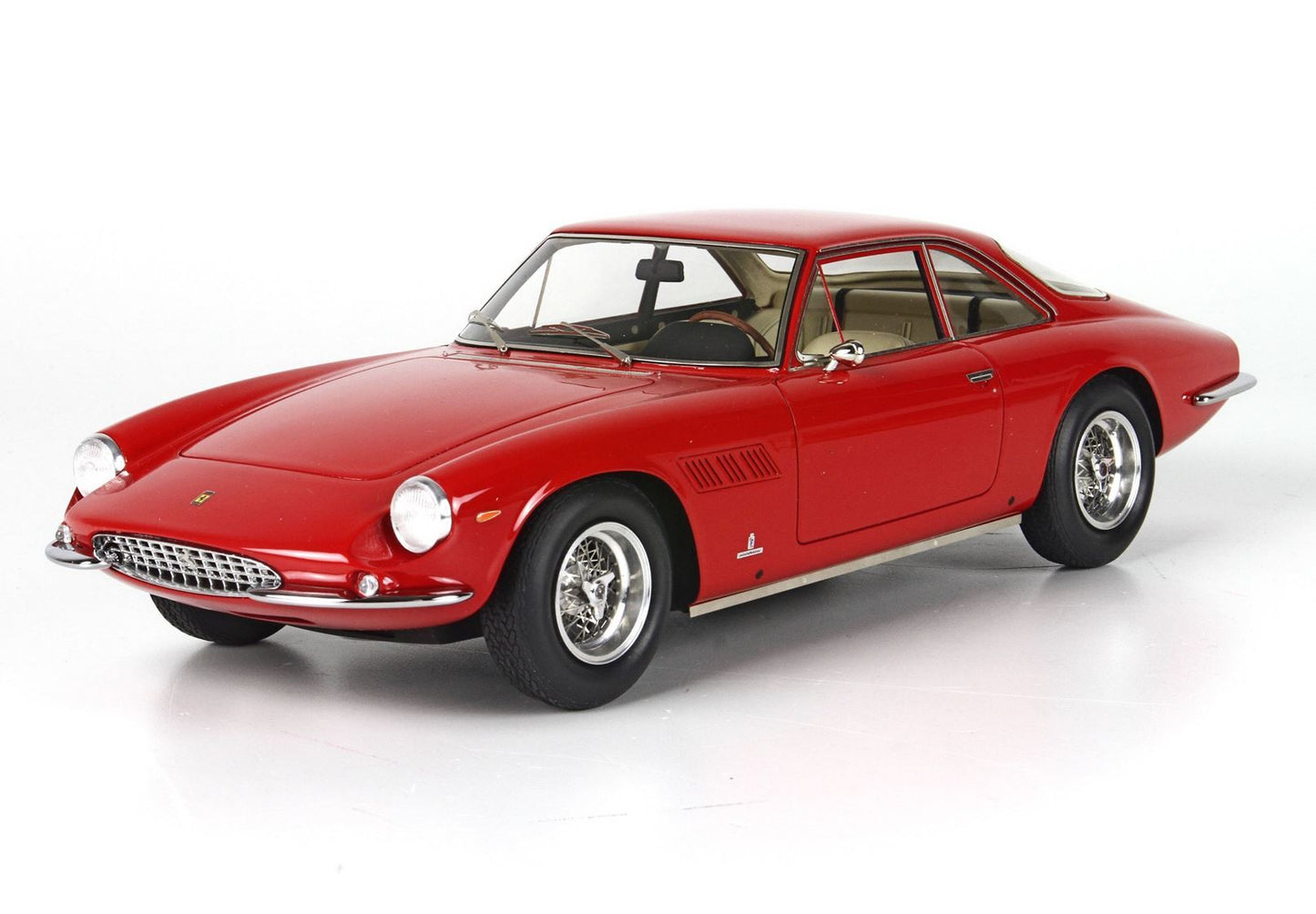 Red vintage sports car model with chrome wheels and detailed interior available to buy via Vroomi