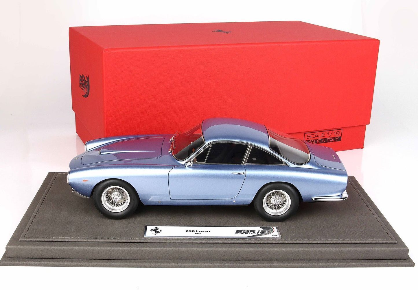 Blue 1963 Ferrari 250 Lusso model car on display platform with red BBR Models box available on Vroomi