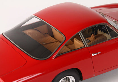 Red vintage sports car model with tan quilted interior, detailed dashboard, available on Vroomi