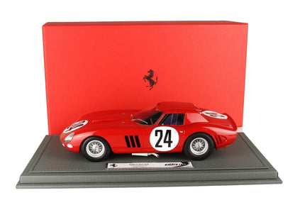Red Ferrari 250 GTO 1:18 scale model car with number 24, displayed on gray base with red Ferrari box, available on Vroomi