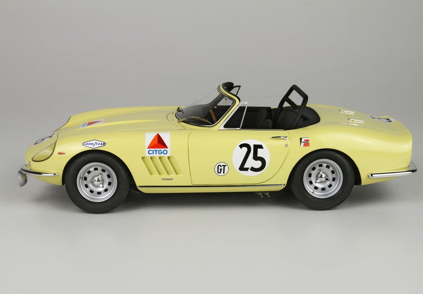 Yellow classic convertible race car with number 25 and sponsor decals, available on Vroomi