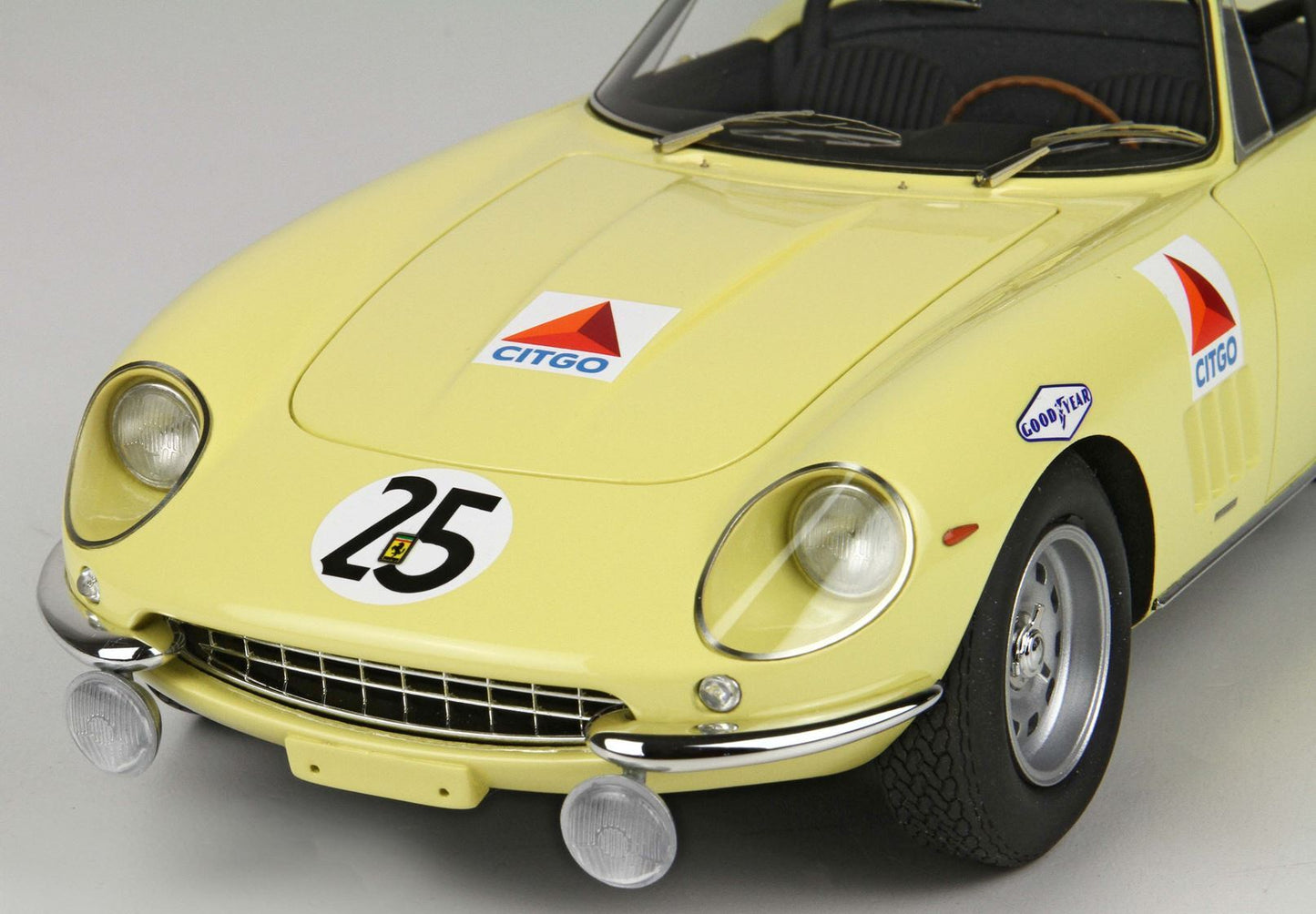 Yellow vintage race car front with number 25, Citgo and Goodyear logos, featured on Vroomi