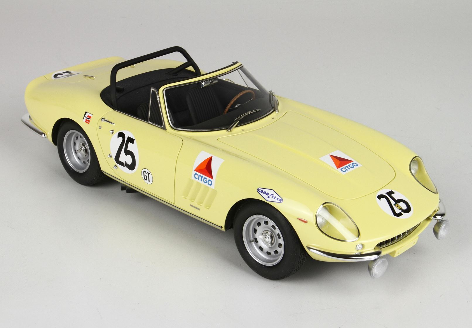 Yellow classic racing convertible car with number 25 and sponsor decals, available on Vroomi