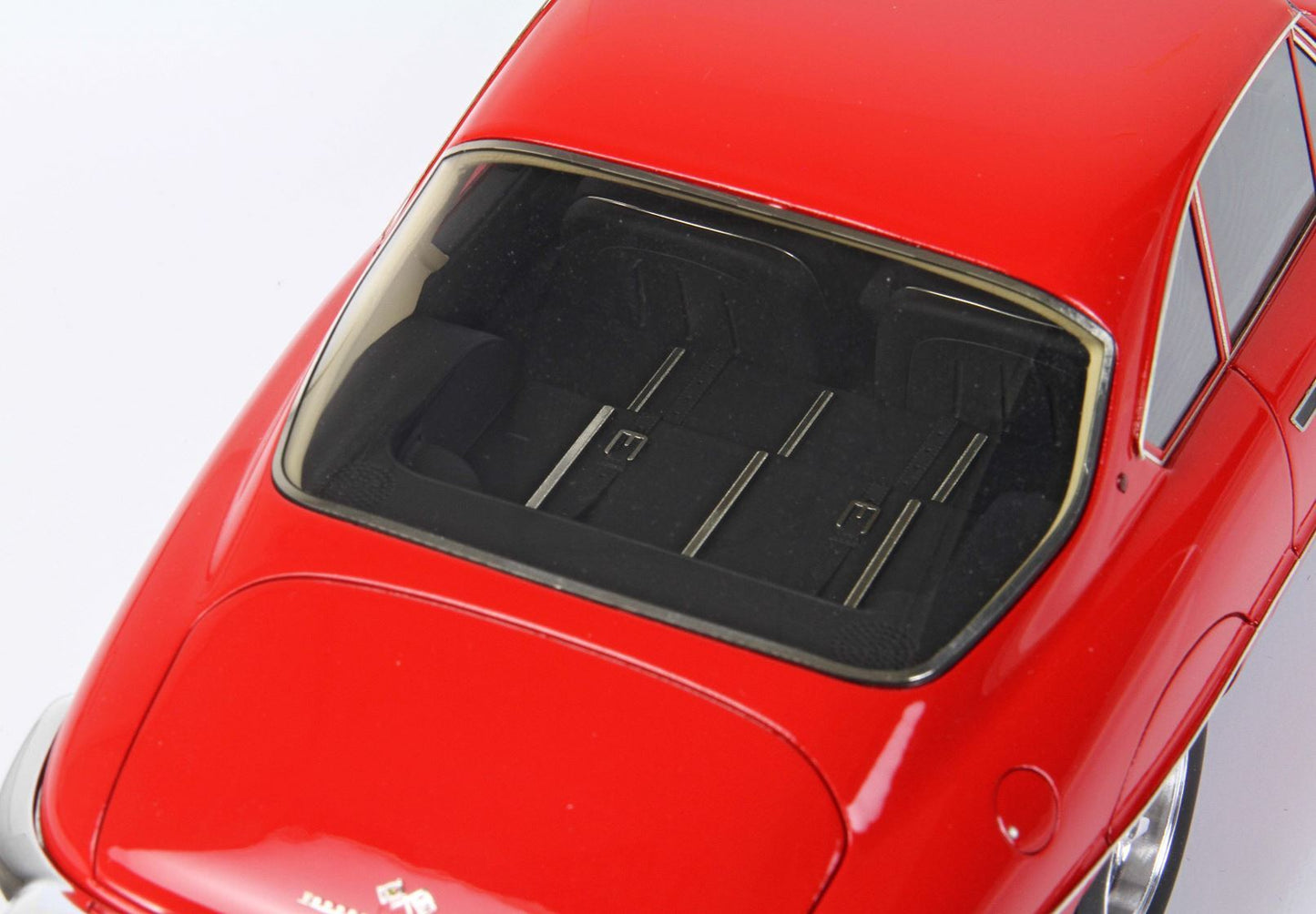 Red classic model car rear view with black interior seats, available on Vroomi platform