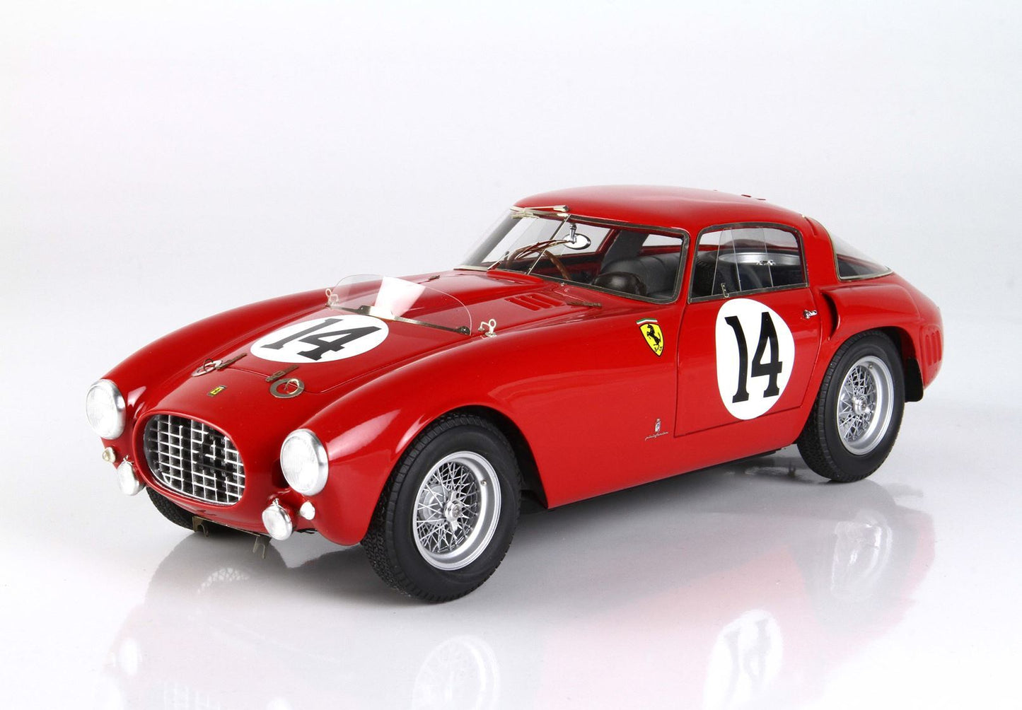 Red vintage Ferrari race car with number 14, wire wheels, and Ferrari badge, now offered on Vroomi