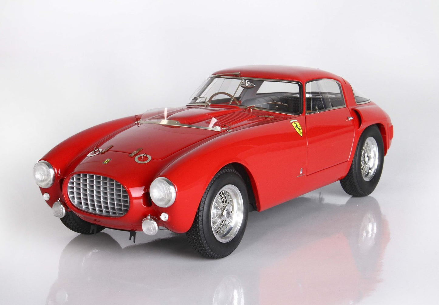 Classic red Ferrari vintage model car with chrome details, showcased and available via Vroomi
