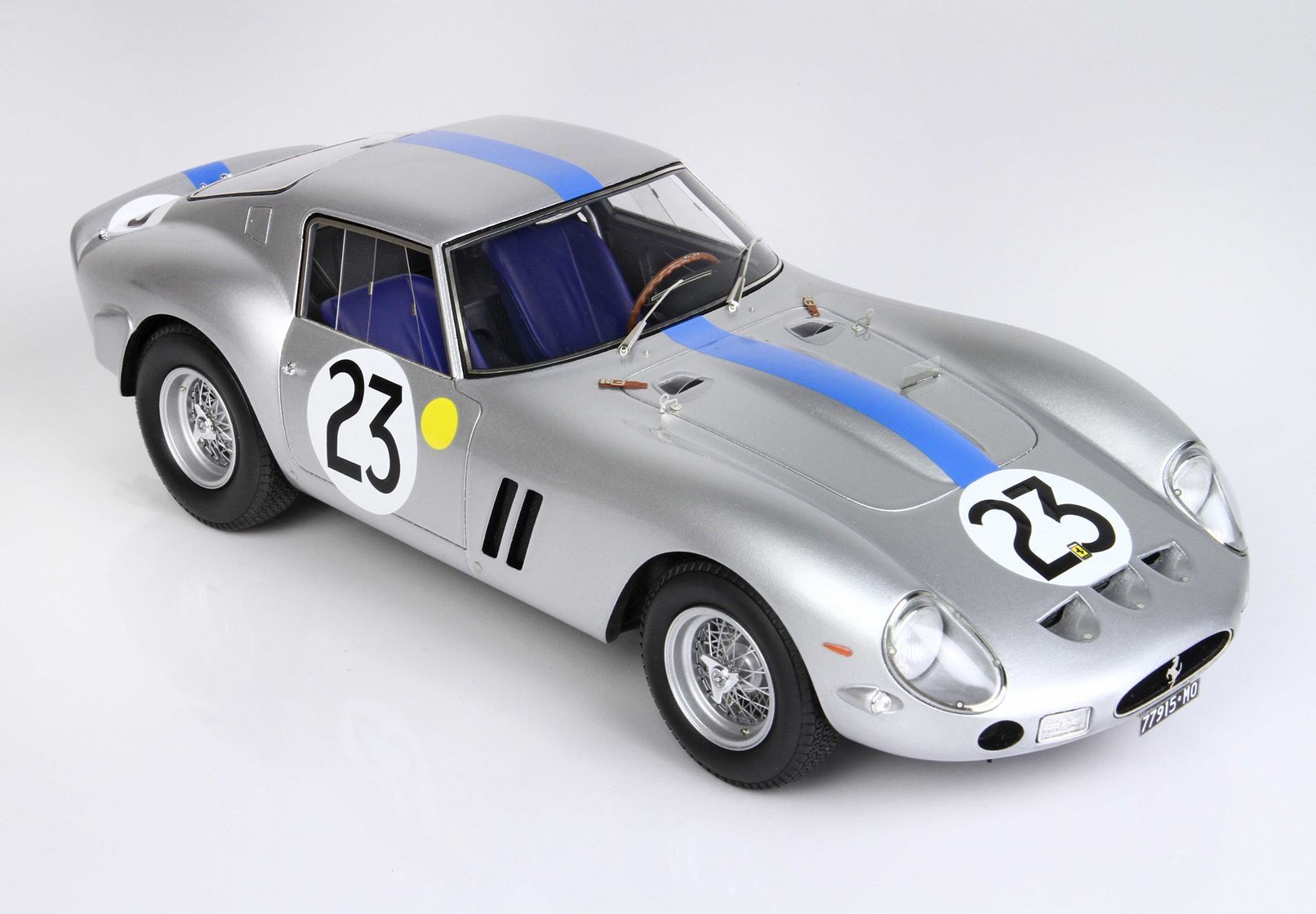 Silver classic race car with number 23 and blue stripe, detailed model available on Vroomi